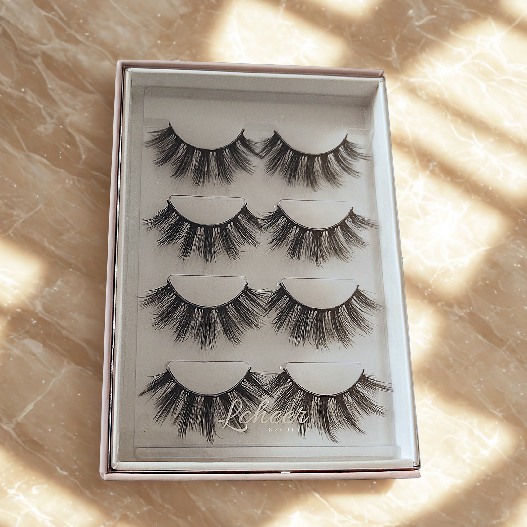 Flared 16mm fake lashes with black band and subtle volume; lightweight reusable strip lashes/false eyelashes suited for hooded eyes and soft glam
