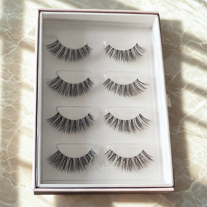 Fluffy 12mm fake lashes made of vegan faux mink with a thin flexible band; reusable strip lashes and natural-looking false eyelashes for soft glam