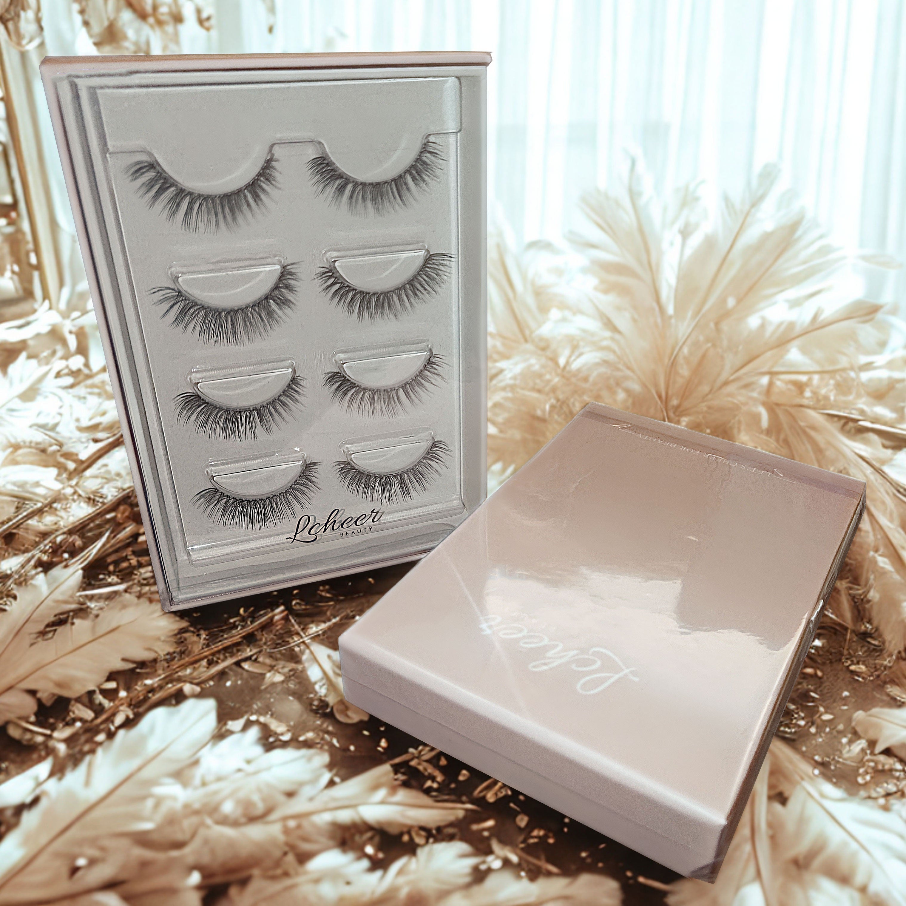 LCHEER Beauty four-pair wispy strip lash set displayed in a reusable storage box