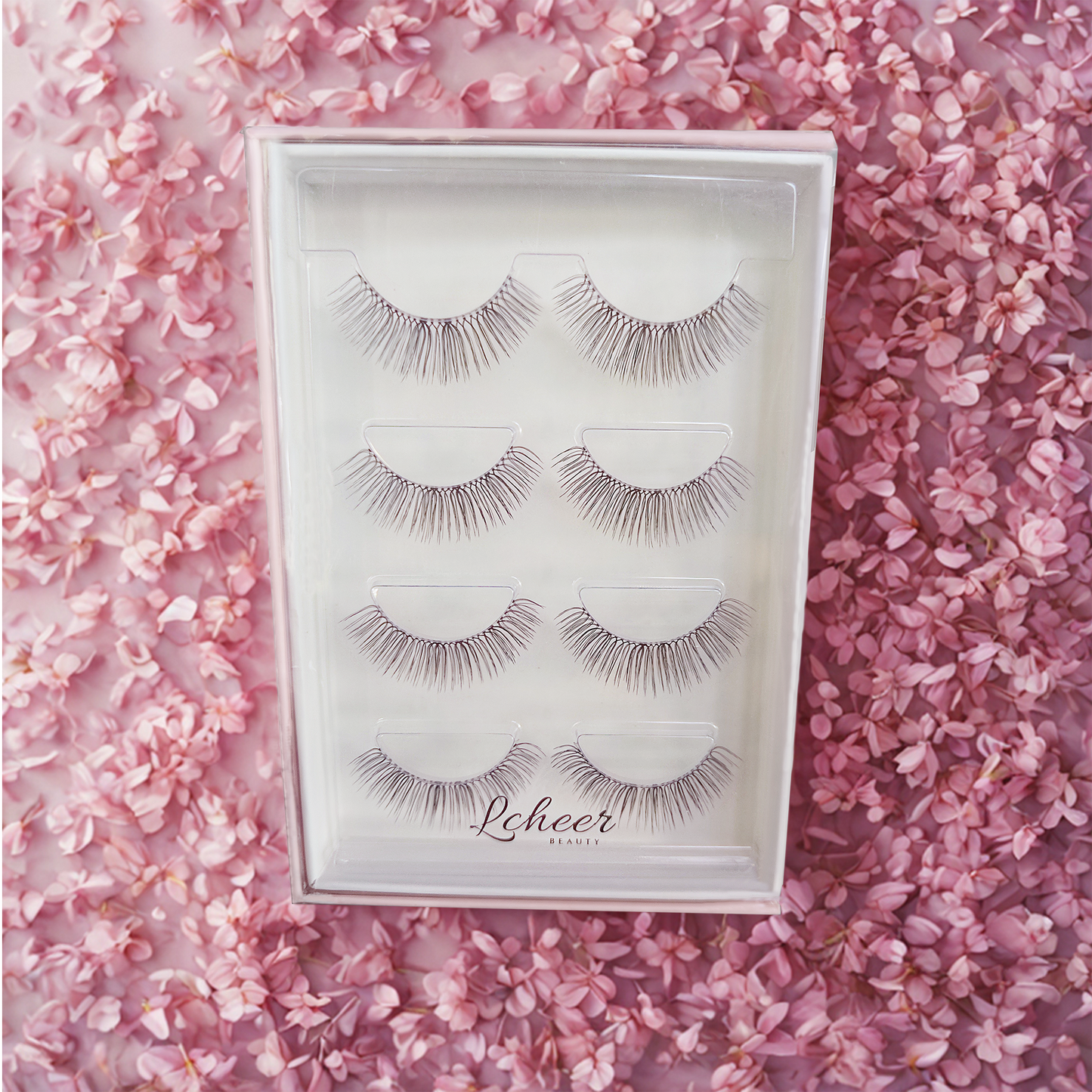 Natural 12–14mm strip lashes in C curl with a clear band; lightweight reusable false eyelashes for everyday makeup
